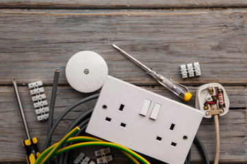 Wall Mural - Electrical tools and equipment on a wooden background