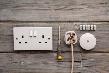 Wall Mural - Electrical tools and equipment on a wooden background