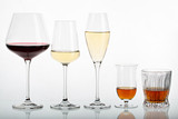 Fototapeta  - Different glasses of drinks: red wine, white wine, champagne, digestif, whiskey.
