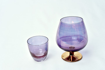 Colorful drinks glass cup on table on white background