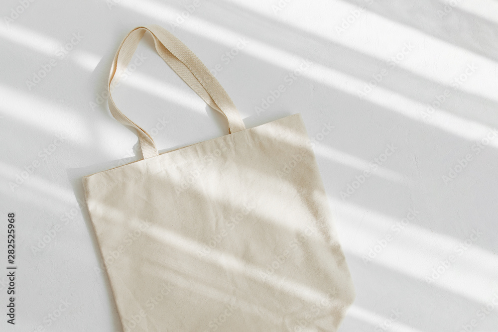 White eco bag mockup. Blank Shopping sack with copy space. Canvas tote bag. Eco friendly / Zero waste concept. - obrazy, fototapety, plakaty 