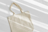 Fototapeta  - White eco bag mockup. Blank Shopping sack with copy space. Canvas tote bag. Eco friendly / Zero waste concept.