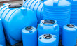 © Andrey - blue plastic barrels for drinking water, liquid storage tanks