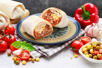 Canvas Print - A burrito - mexican dish that consists of a flour tortilla with various ingredients.