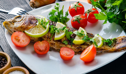 Fried fish served on the plate