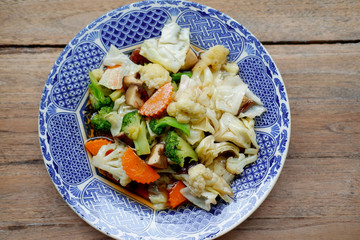 Poster - stir fried vegetables on wood table