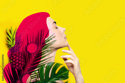 Leinwand Poster  Contemporary art collage of beautiful woman with tropical fruits and palm leaves on yellow background