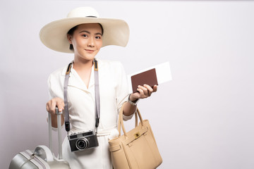 Tourist woman with suitcase isolated on white background