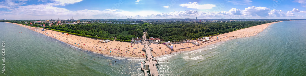 Summer beach panorama with wooden pier at Baltic Sea in Gdansk, Poland. - obrazy, fototapety, plakaty 