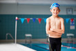 © Monkey Business - Portrait Of Boy Standing By Edge Of Swimming Pool Ready For Lesson