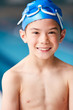 © Monkey Business - Portrait Of Boy Standing By Edge Of Swimming Pool Ready For Lesson