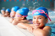 © Monkey Business - Portrait Of Children In Water At Edge Of Pool Waiting For Swimming Lesson