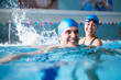 © Monkey Business - Female Swimming Teacher Giving Man One To One Lesson In Pool
