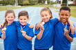 © Monkey Business - Portrait Of Children Showing Off Winners Medals On Sports Day
