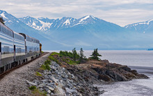 Turnagain Arm Of Cook Inlet In Alaska From The Train Showing The Shoreline With Mountains And Glaciers In The Background