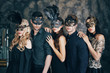 © GVS - Group of people in masquerade carnival mask posing in studio