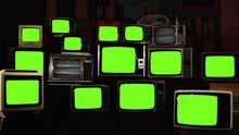Stacked Retro Vintage TVs Turning On Green Screens. You Can Replace Green Screen With The Footage Or Picture You Want With “Keying” Effect In AE (check Out Tutorials On Internet).