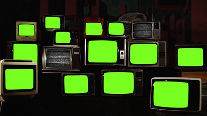 Wall Mural - stacked retro vintage tvs turning on green screens. you can replace green screen with the footage or