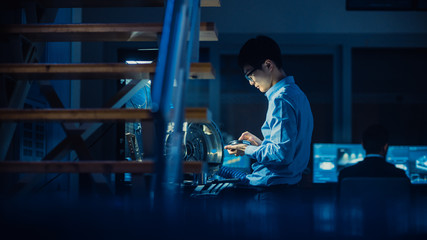 Poster - Professional Automotive Engineer in Glasses is Working on Transmission Gears in a High Tech Innovative Laboratory with a Computer Screens.