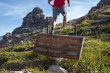 Wall Mural - a hiker near the forcella urtisiel in the friulian dolomites, in italy