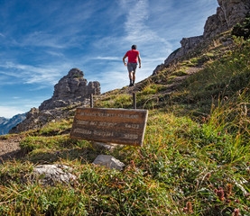 Wall Mural - a hiker near the forcella urtisiel in the friulian dolomites, in italy