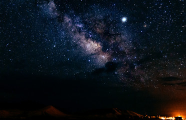 the milky way above a desert town