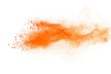 Wall Mural - Abstract orange powder explosion. Closeup of orange dust particle splash isolated on white background
