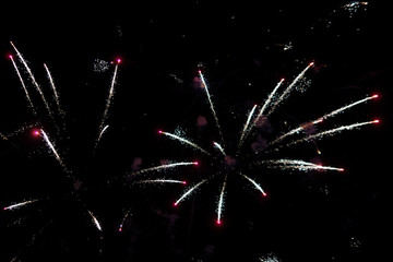 Festive salute. Bright and colorful fireworks explode in the sky. New Year.