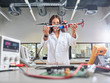 © Westend61 - Female technician working in research laboratory, holding drone