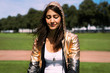 © Westend61 - Portrait of young woman wearing shiny jacket, hood