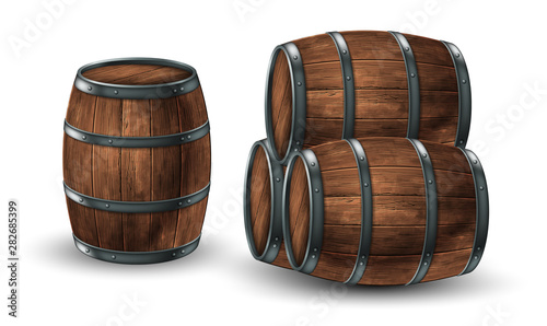 Fotomural Four wooden barrels for wine or other drinks, studded with iron rings on a white background