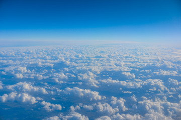 Canvas Print - Sky and clouds from above the ground viewed from an airplane