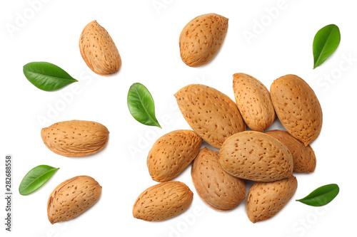 Cuadros en Lienzo almonds with green leaves isolated on white background. top view.