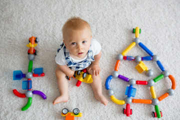 Sticker - Sweet baby boy, toddler child, playing at home with lots of toys