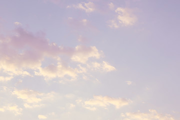 pastel yellow pink cumulus clouds background