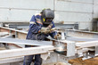 Welder welds building structures manual metal arc welding
