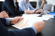 © Pixel-Shot - Businessman with document during meeting in office, closeup
