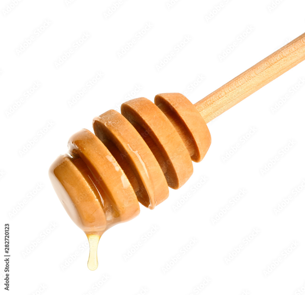 Wooden honey dipper on white background