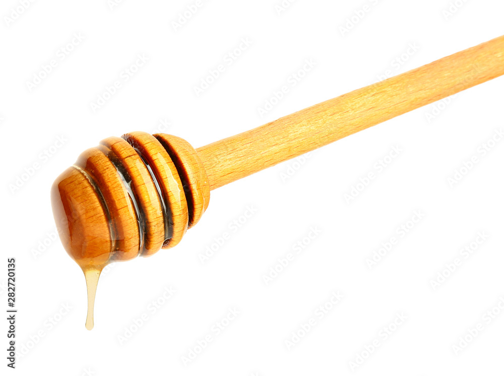 Wooden honey dipper on white background