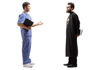 Wall Mural - Priest and a male doctor having a conversation