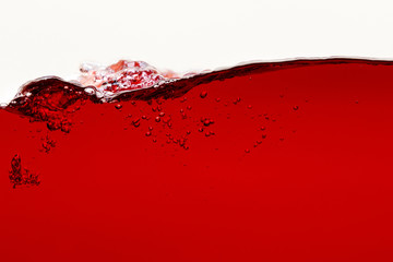 ripple red bright liquid with bubbles isolated on white