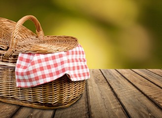 Canvas Print - Picnic Basket with napkin om nature background