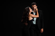 © LIGHTFIELD STUDIOS - passionate girl in dress touching handsome bearded man isolated on black