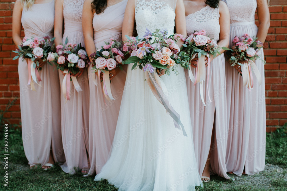bride and bridesmaids holding wedding bouquets, pink bridesmaids dresses,  detail shot, copy space Stock Photo | Adobe Stock