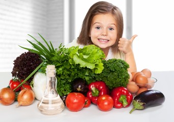 Canvas Print - Portrait of adorable little girl preparing healthy food at kitchen