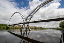 The Famous Infinity Bridge Located In Stockton-on-Tees Taken On A Bright Sunny Part Cloudy Day.