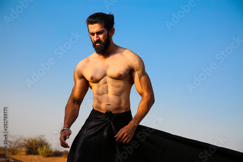 Young Handsome Long Hair And Beard Asian Muscled Fit Male Model