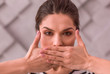 © zinkevych - Young woman covering her mouth with hands