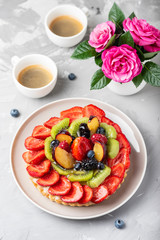 Canvas Print - tart with strawberries, kiwi, plums and cream