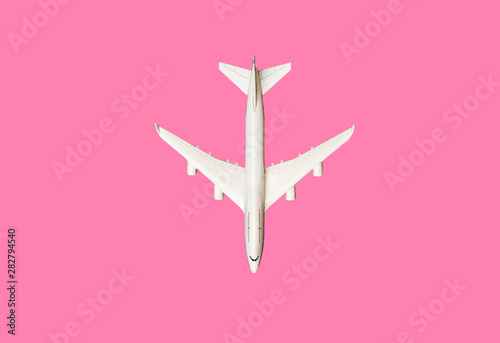 Model plane, airplane on pink pastel color background with copy space Fotobehang